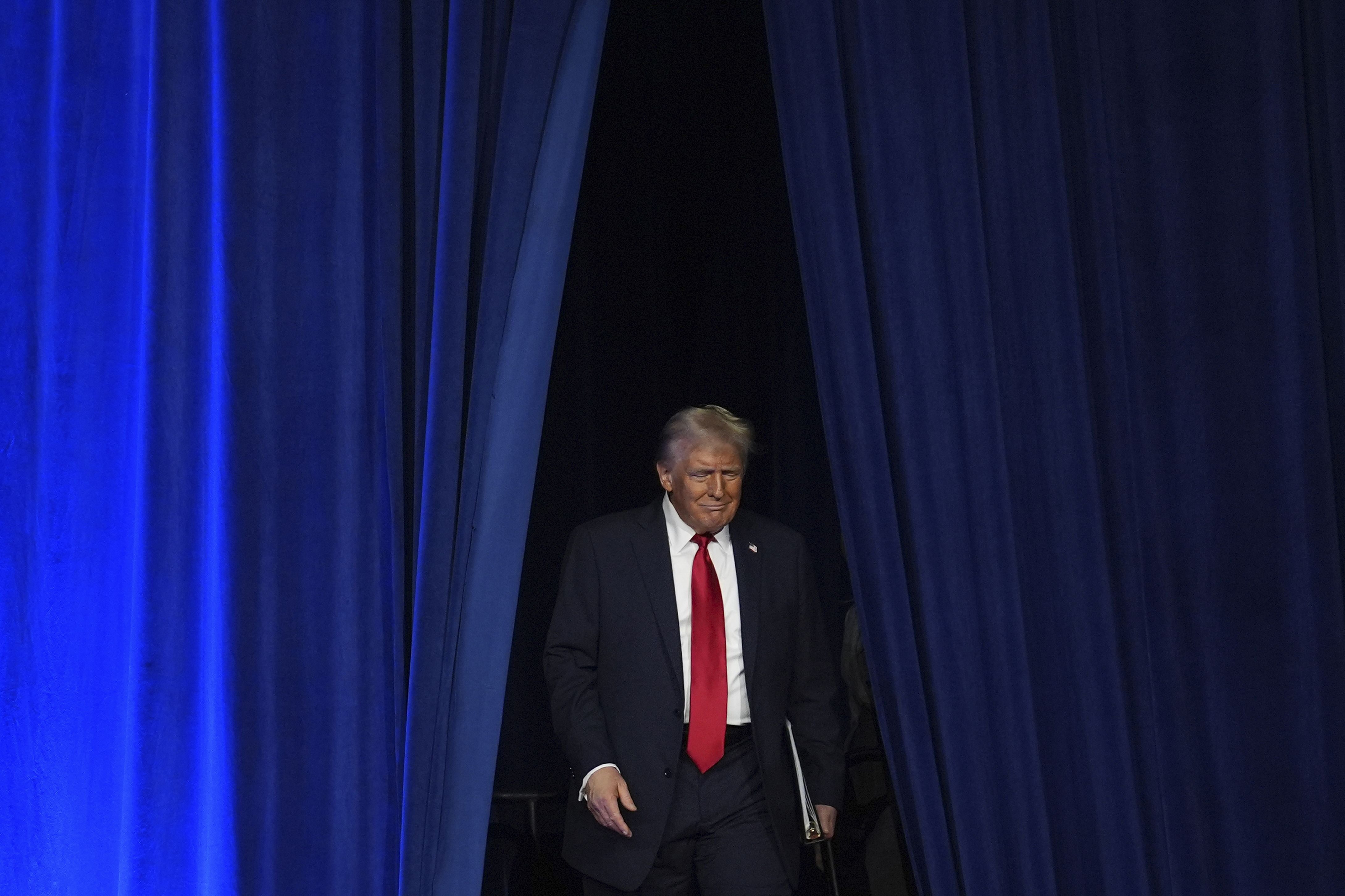 Republican presidential nominee former President Donald Trump arrives at an election night watch party at the Palm Beach Convention Center, Wednesday, Nov. 6, 2024, in West Palm Beach, Fla.