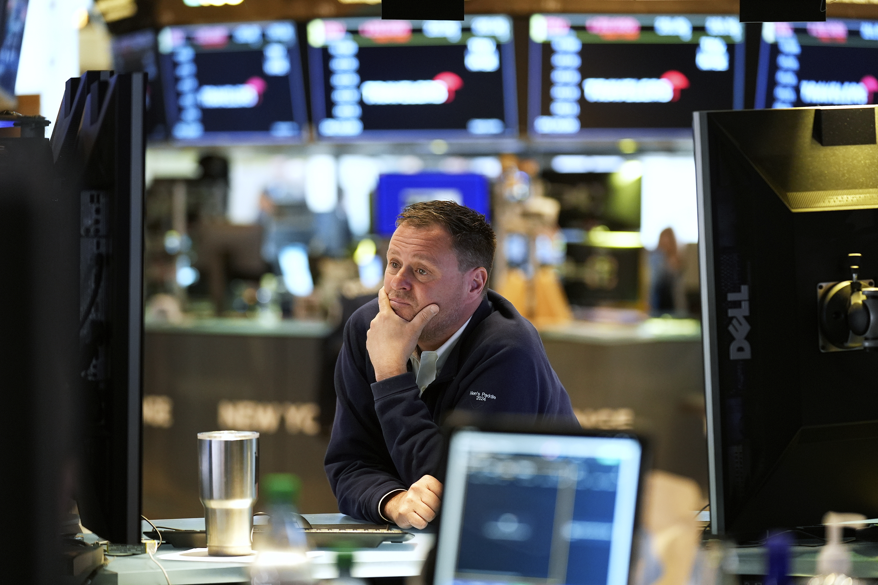 Traders work on the floor at the New York Stock Exchange in New York, Monday, April 7, 2025.