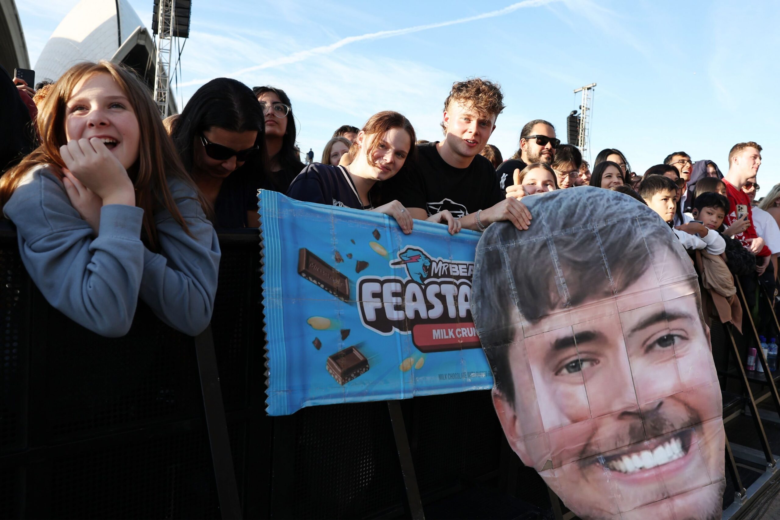 Young fans of the content creator MrBeast watch him onstage during an event on June 26, 2024 in Sydney, Australia.