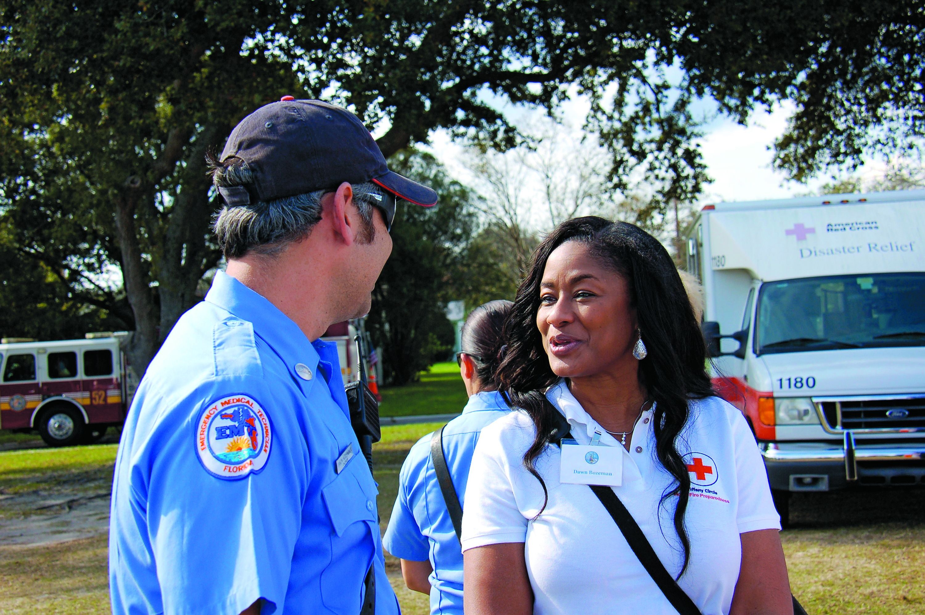 ON THE JOB &mdash; AND GIVING: Dawn Bozeman works with emergency personnel to install smoke detectors. She is a member of a Red Cross women’s-giving circle that raised $7.7 million last year, more than two-and-a-half times what it collected in 2007. 
