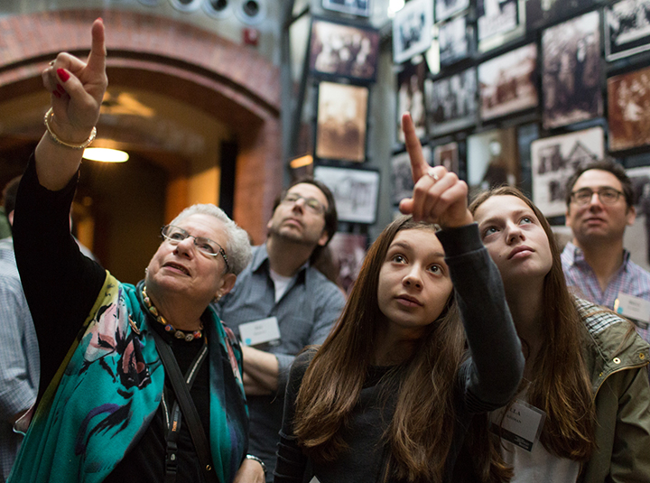 Visitors to the U.S. Holocaust Memorial Museum take in the Tower of Faces, part of the Washington institution’s permanent collection. Financier Allan Holt and his wife, Shelley, donated $20 million to maintain and upgrade the collection.