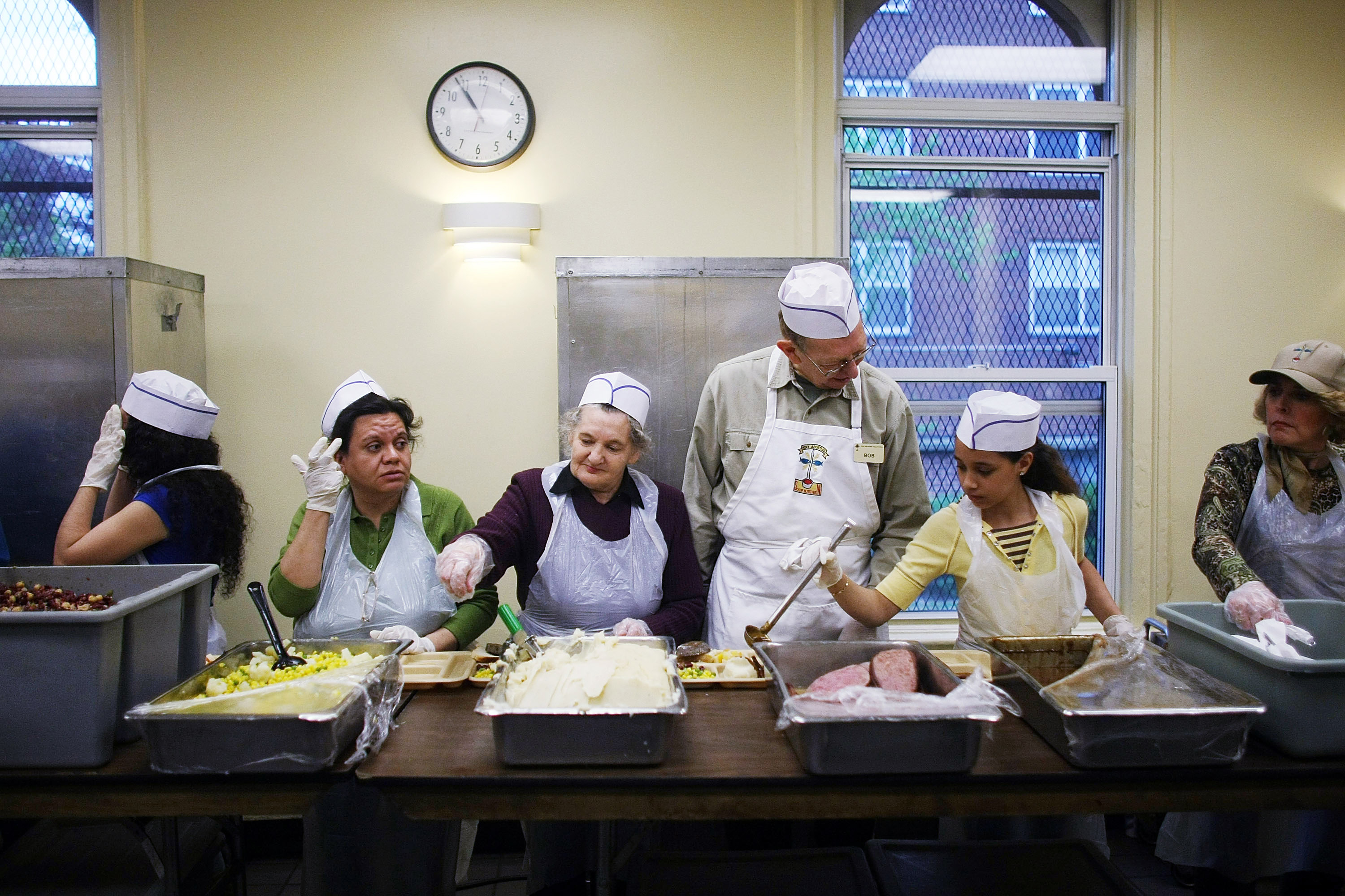 Volunteers prepare meals at the Holy Apostles Soup Kitchen in New York City.