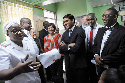 GLOBAL REACH: Rajiv Shah, center, visits a hospital in Lagos, Nigeria. Mr. Shah says that under his leadership, the Rockefeller Foundation’s priorities will remain the same as before: health, food, and economic equality around the world.
