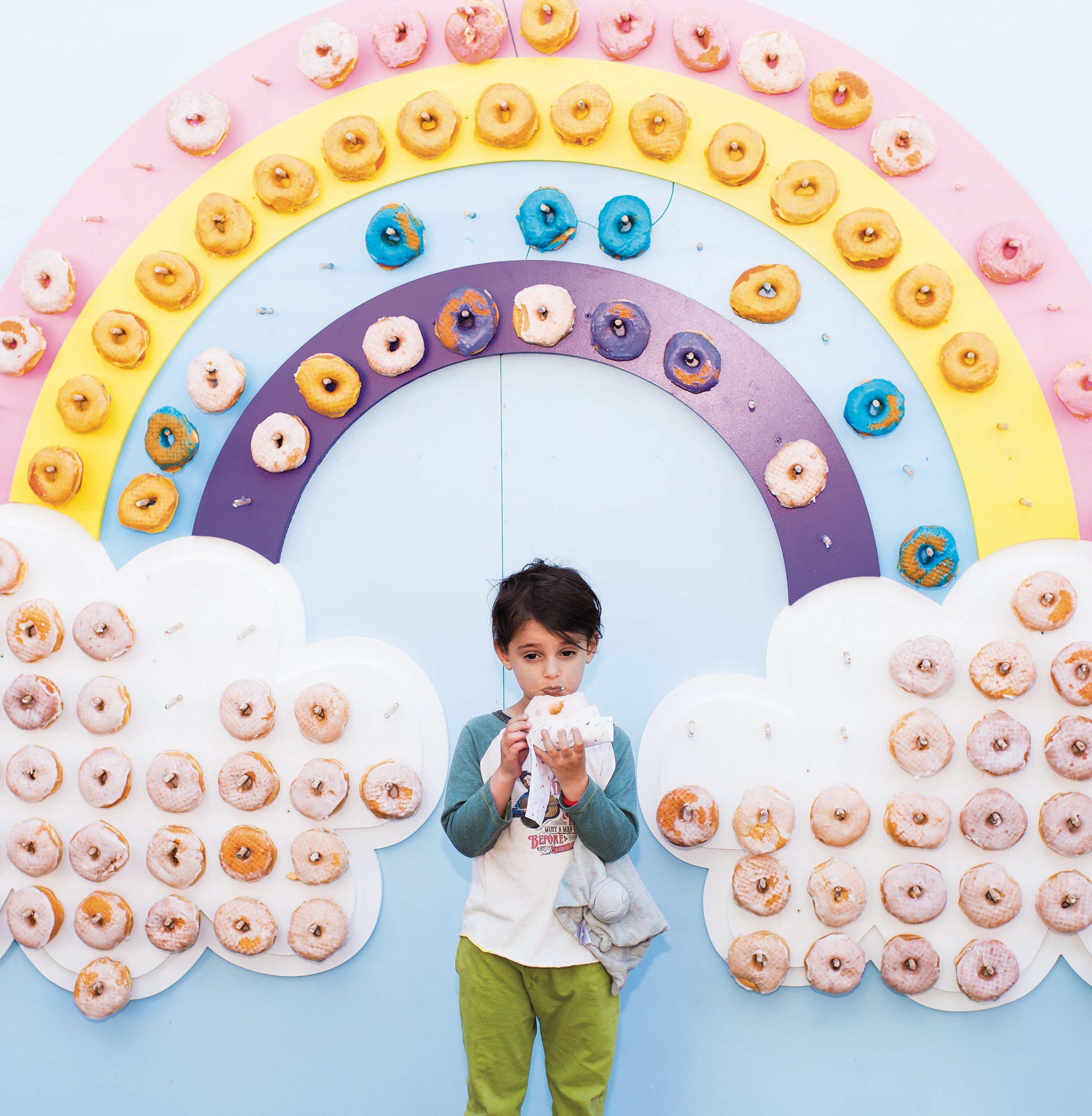 GLAZED OR SPRINKLES? A doughnut wall brings energy and fun to a benefit at the Zimmer Children’s Museum.