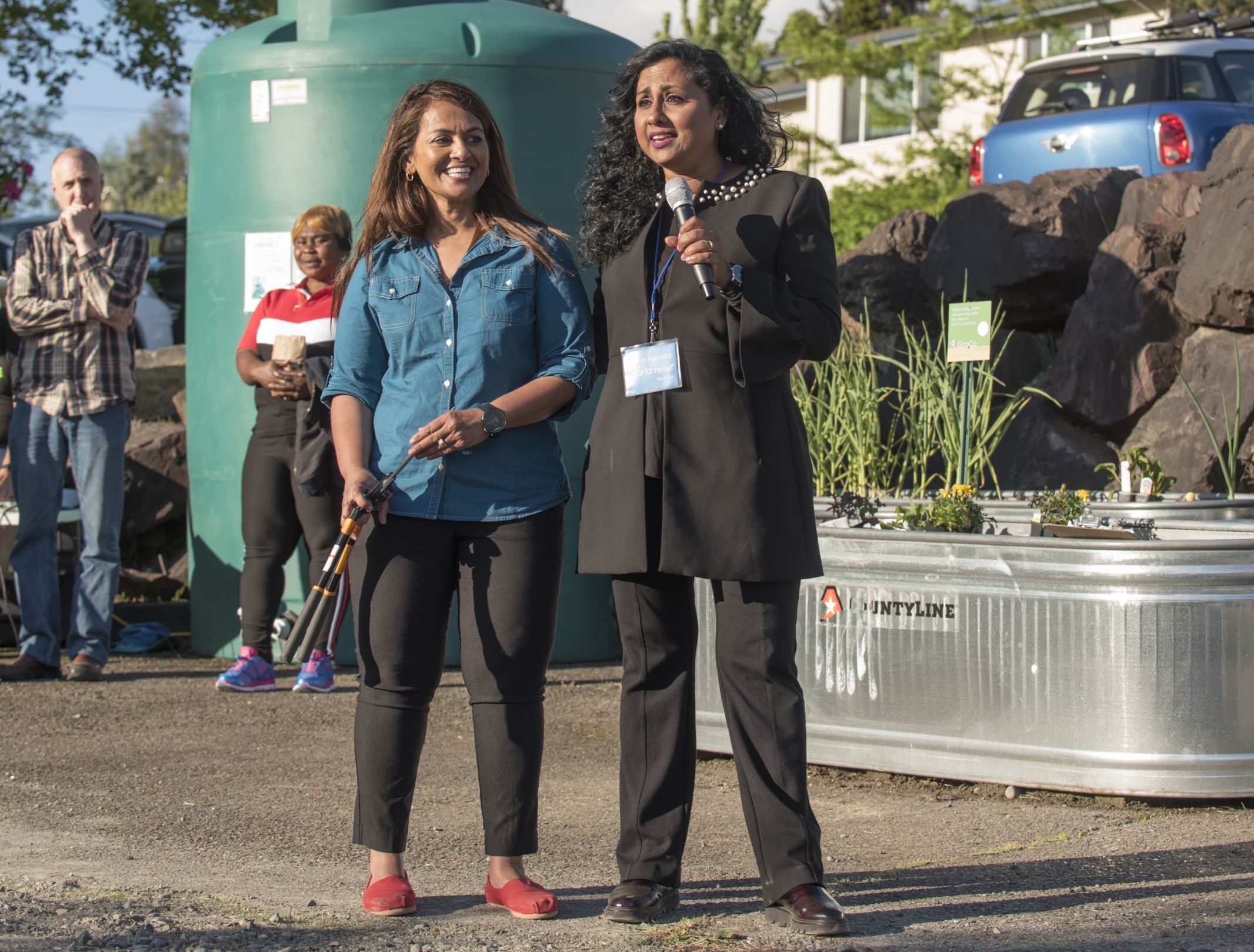 Chitra Hanstad, executive director of World Relief Seattle, and Tahmina Martelly (WRS Resiliency Programs Manager) at the grand opening of Paradise Parking Plots Community Garden in Kent.