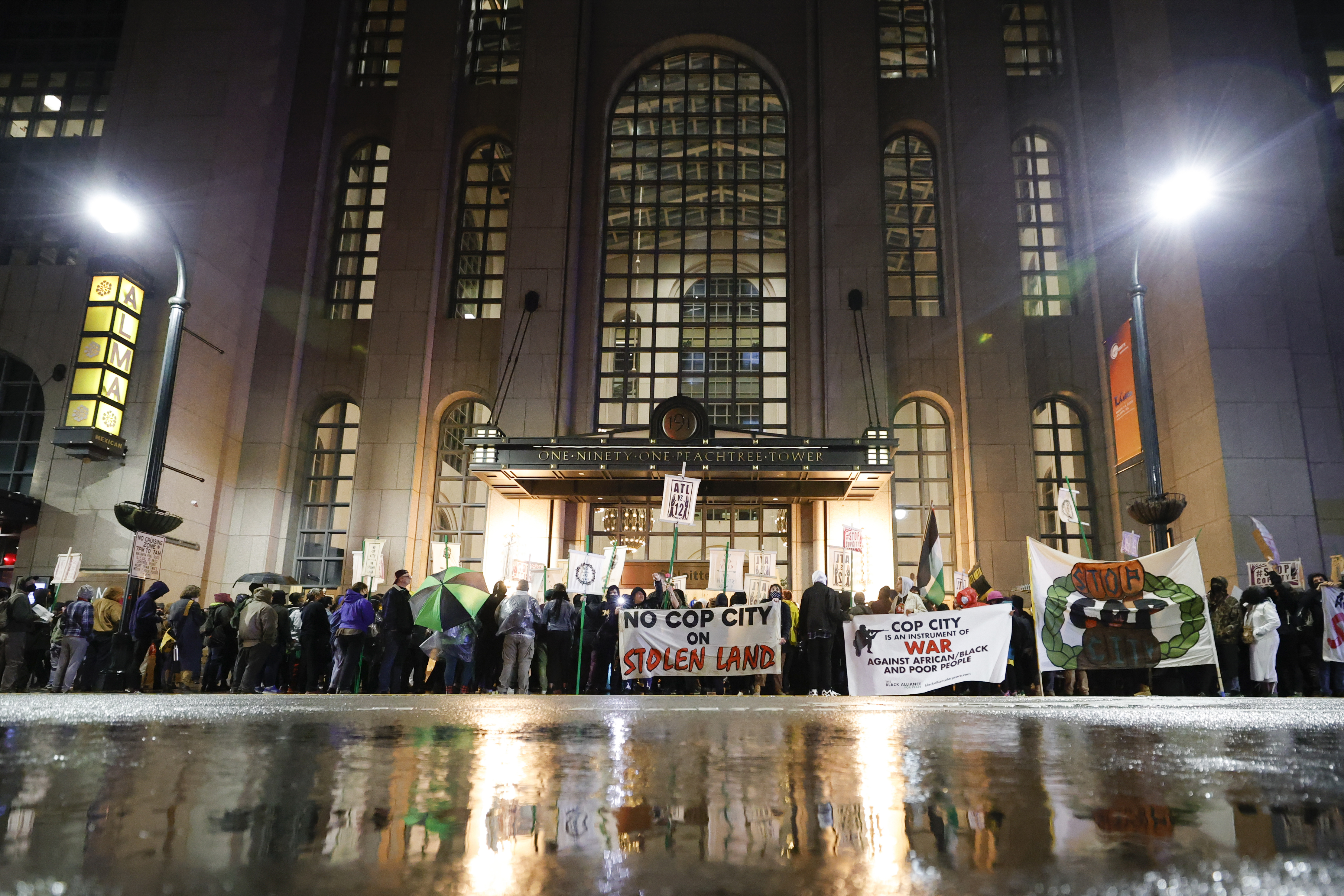 Demonstrators gather outside of the Atlanta Police Foundation headquarters during a protest over plans to build a new police training center, Thursday, March 9, 2023, in Atlanta.