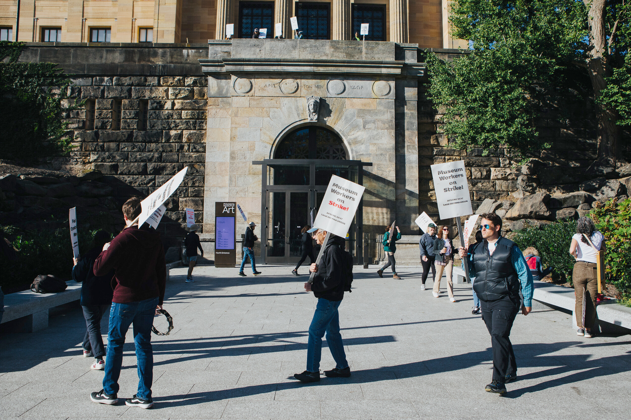 Workers picket outside the entrances of the Philadelphia Museum of Art in Philadelphia, Thursday, Sept. 29, 2022. Members of the union, which represents about 180 museum workers, are seeking its first contract.