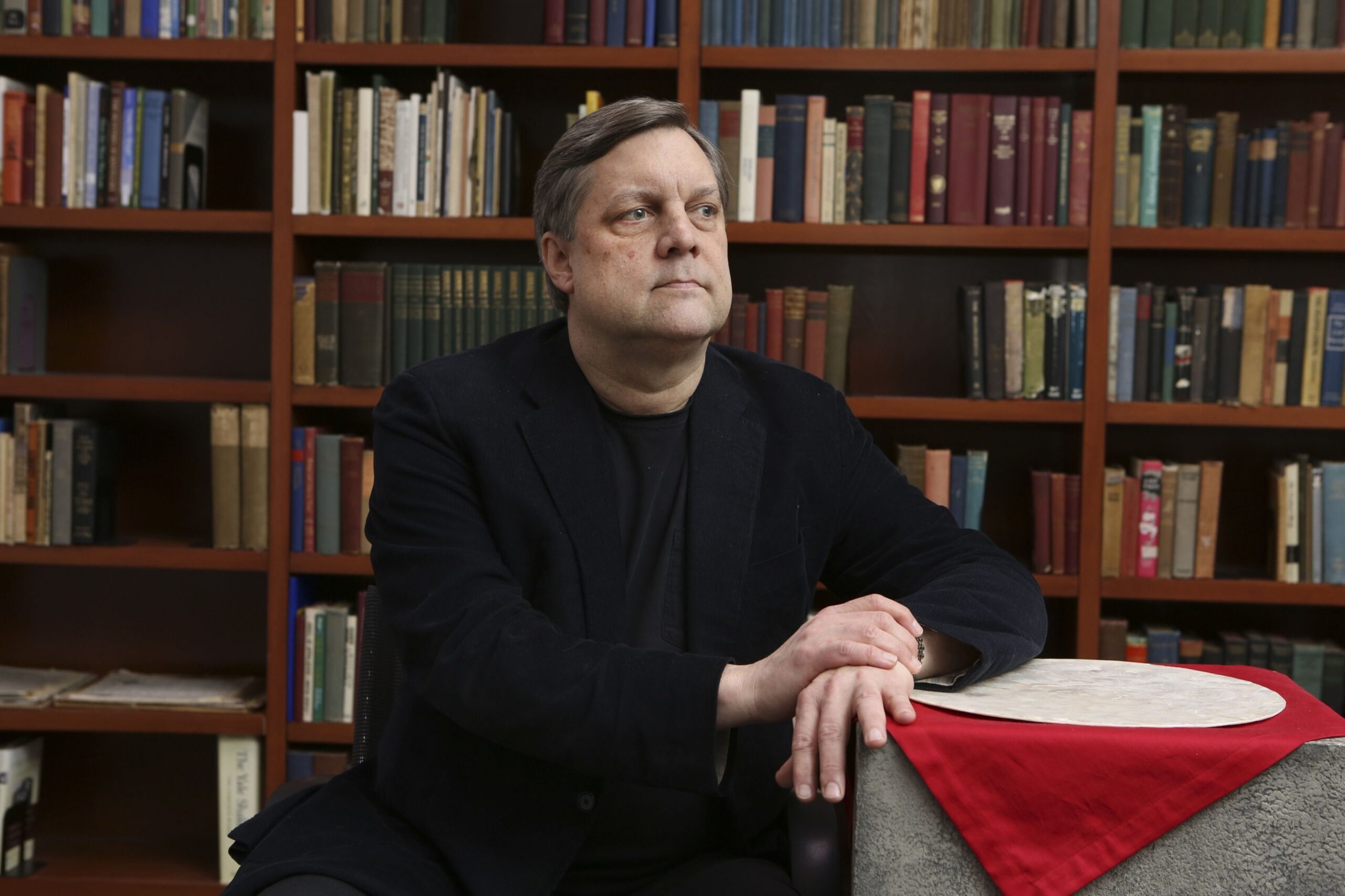 David Blankenhorn, the head of the Institute for American Values and a former opponent of same-sex marriage, at his office in New York, Jan. 28, 2013. He is sitting in front of book shelves.