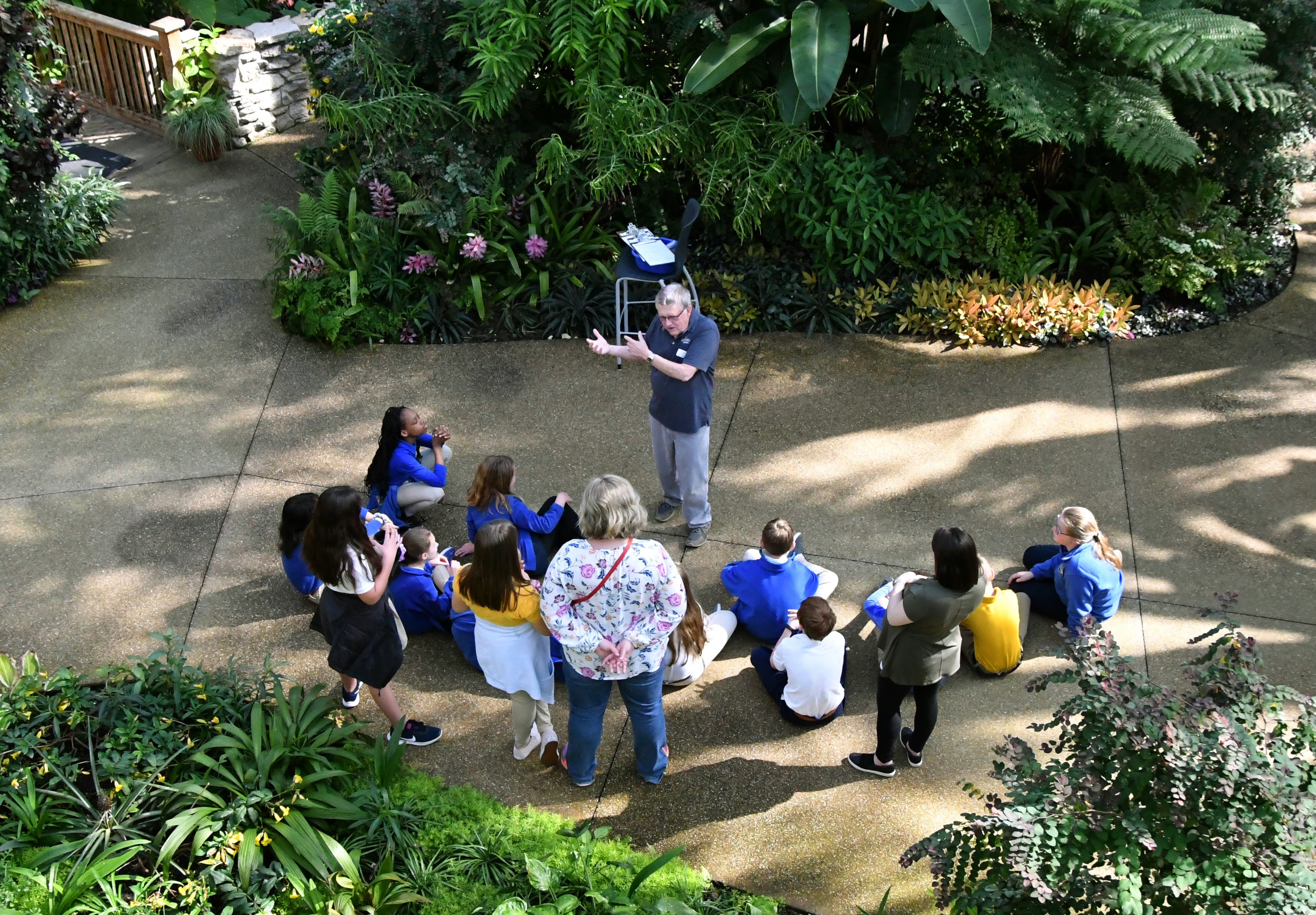 Volunteer educator, Bob Roberts, leading an Ecosystems on the Edge field trip at The Greater Des Moines Botanical Garden. Educators are important to the program offerings at the Greater Des Moines Botanical Garden. Volunteers lead or provide support for field trips, many types of tours, programs and classes, and camps.