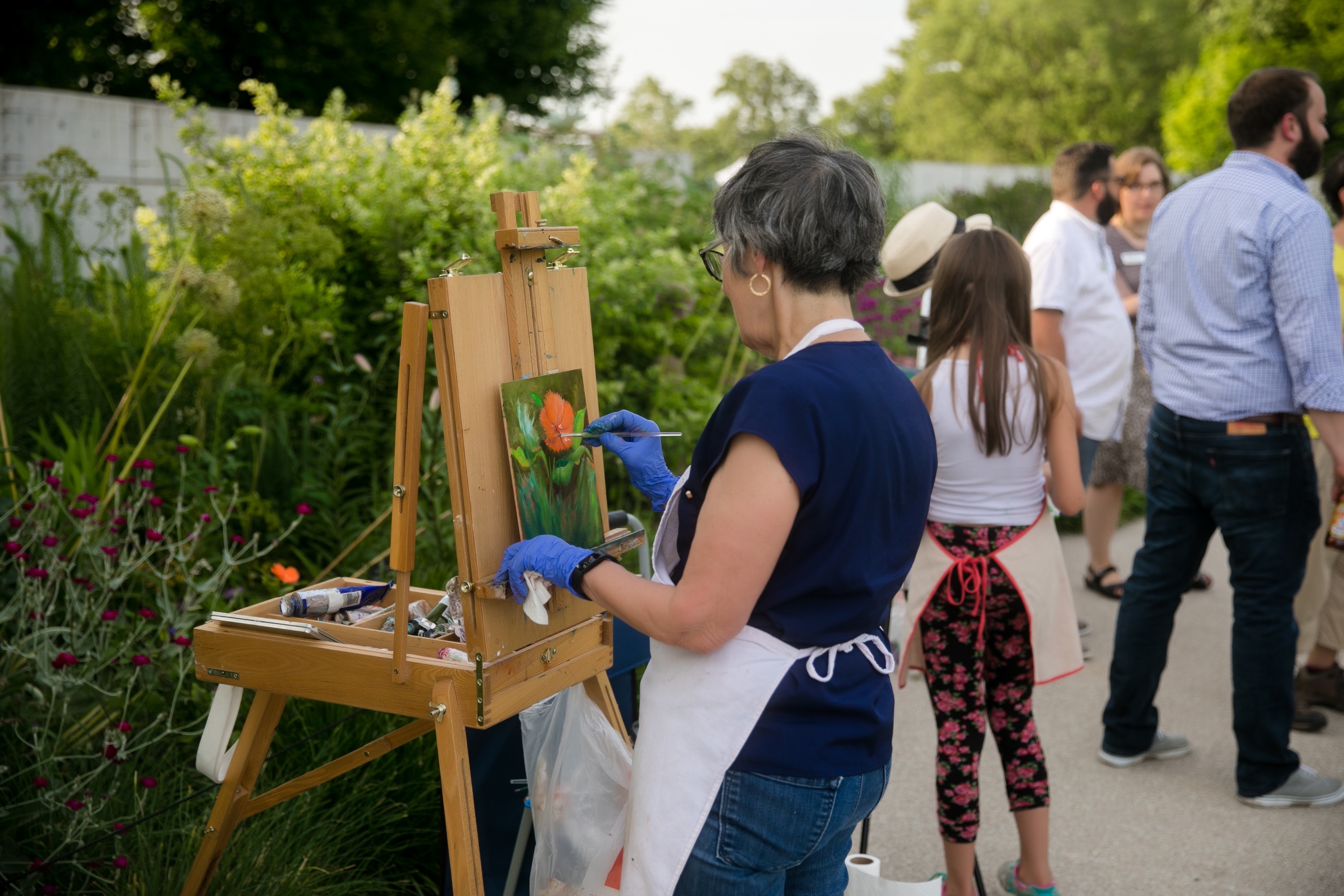 Artists in the Garden volunteers use the summer beauty to create art during the summer concert series, Music in the Garden. Guests are welcome to watch and ask questions as the artists work. This volunteer role is part of the Botanical Artisan Guild, a group of volunteers who create botanically themed arts, crafts and wood products that are sold in the gift shop to support the organization. This role provides the opportunity not only to support the non-profit organization but to be involved while working from home or provides a social outlet working with small groups of volunteers to create products. Volunteers of all skill levels can be involved.