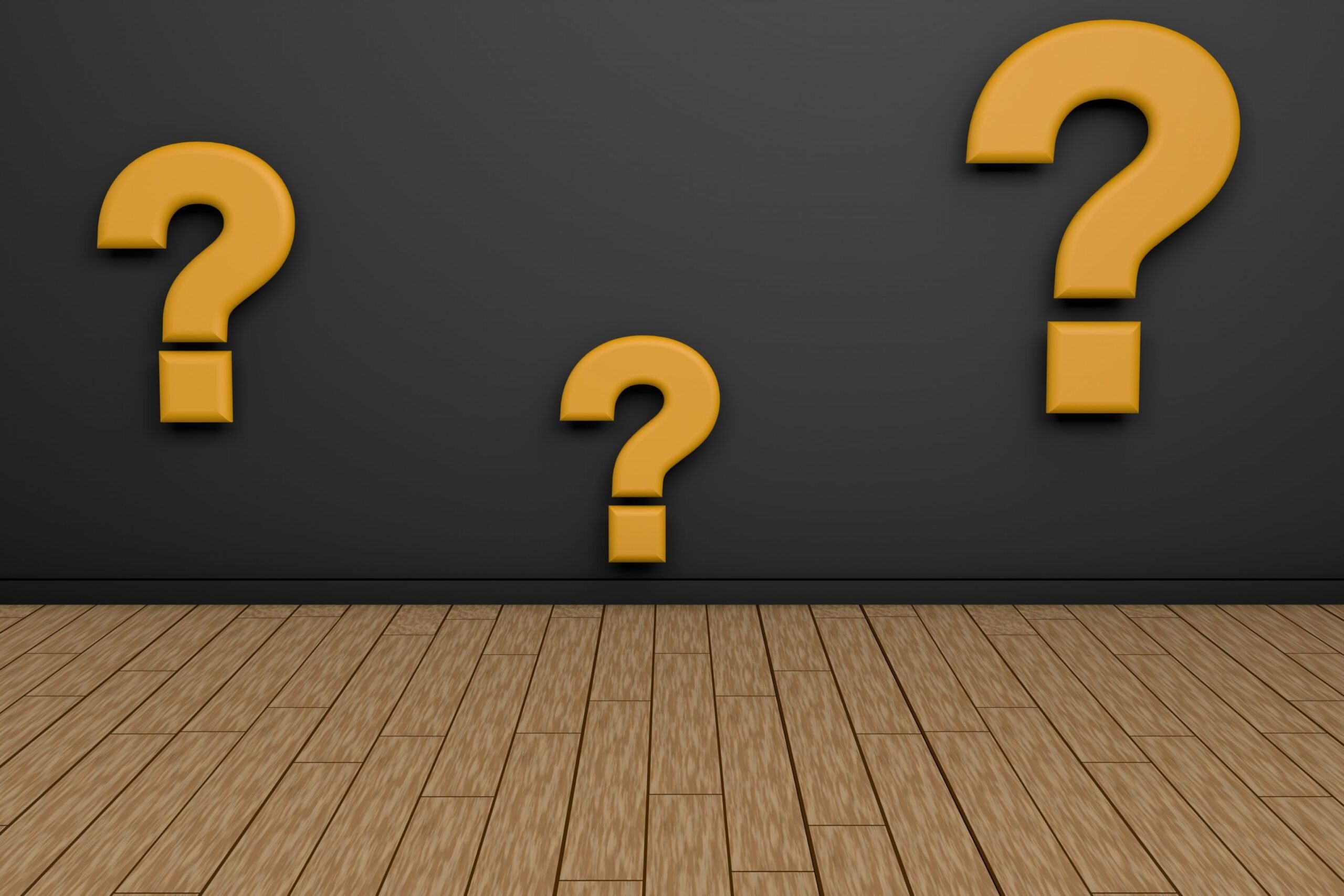 3d rendering of yellow question marks on black background and wooden surface. Problems and solutions. Find the best question for the best solution. Photo illustration. (iStock)