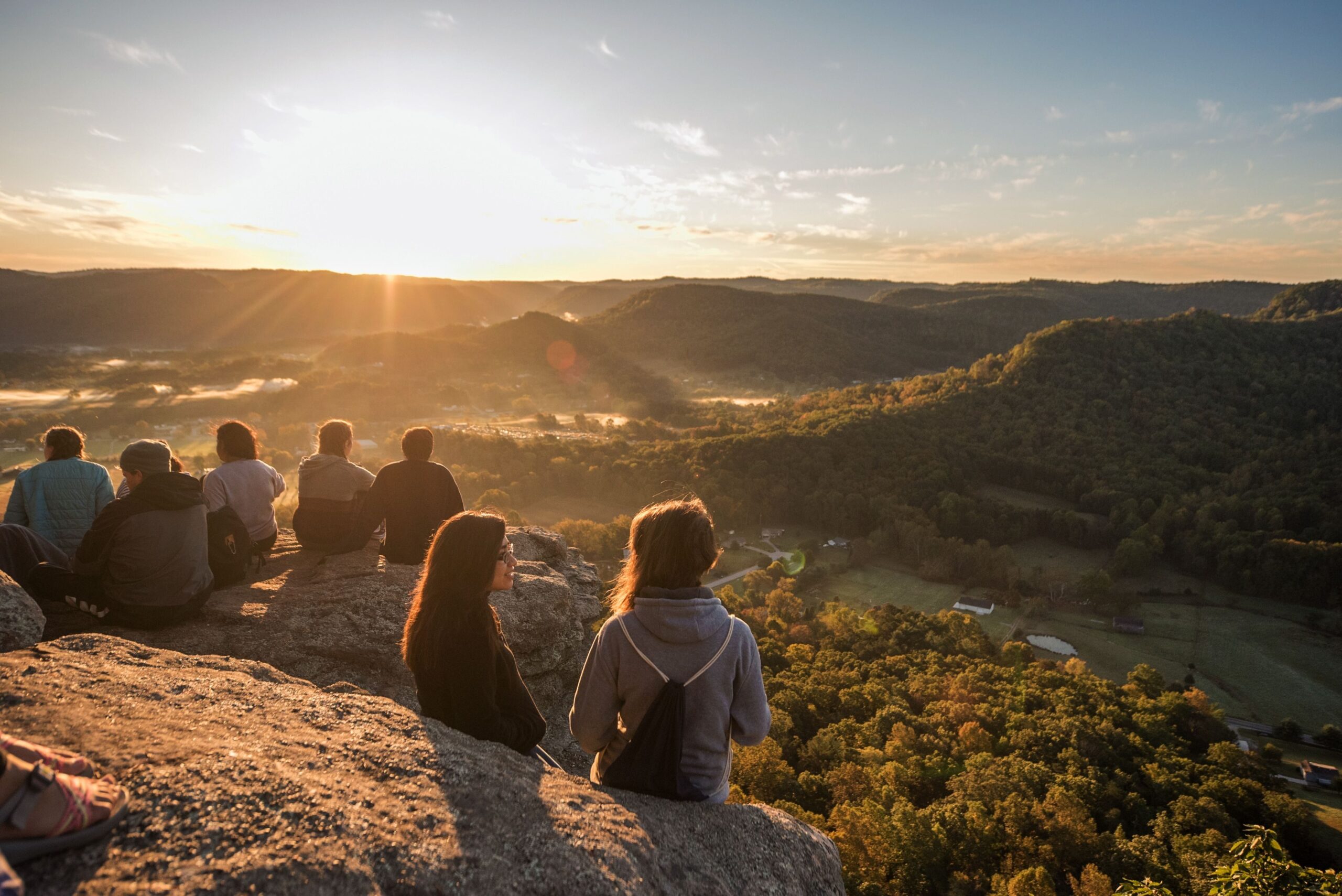 Students sit atop Indian Fort Mountain during Berea College Mountain Day, an annual event held each fall to celebrate the environment of the surrounding Appalachian region, in Berea, Kentucky, on Oct. 18, 2017.
