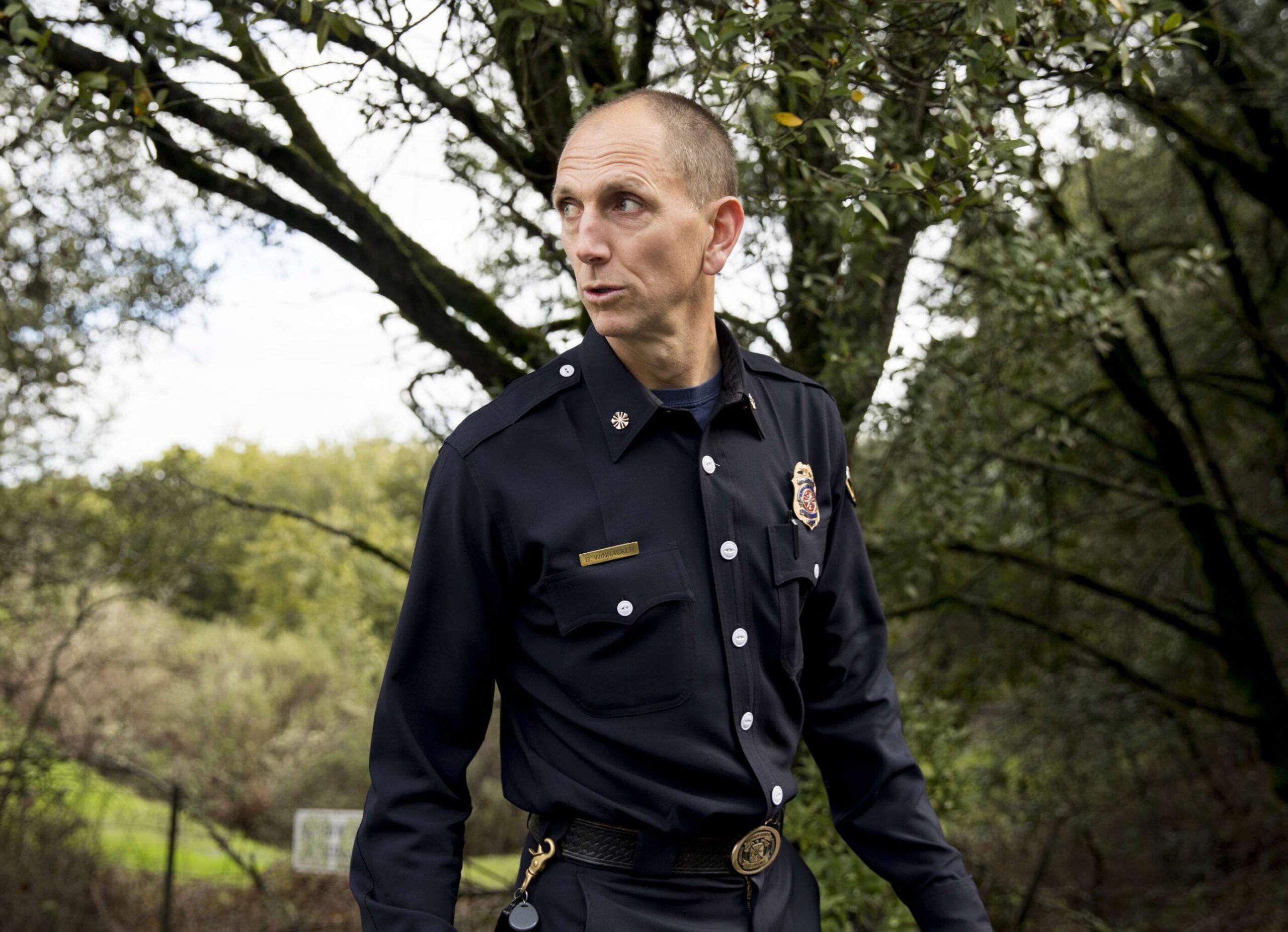 Moraga-Orinda Fire Department Chief David Winnacker walks along Wildcat Canyon Road near Inspiration Point in Orinda, Calif. Thursday, March 7, 2019.