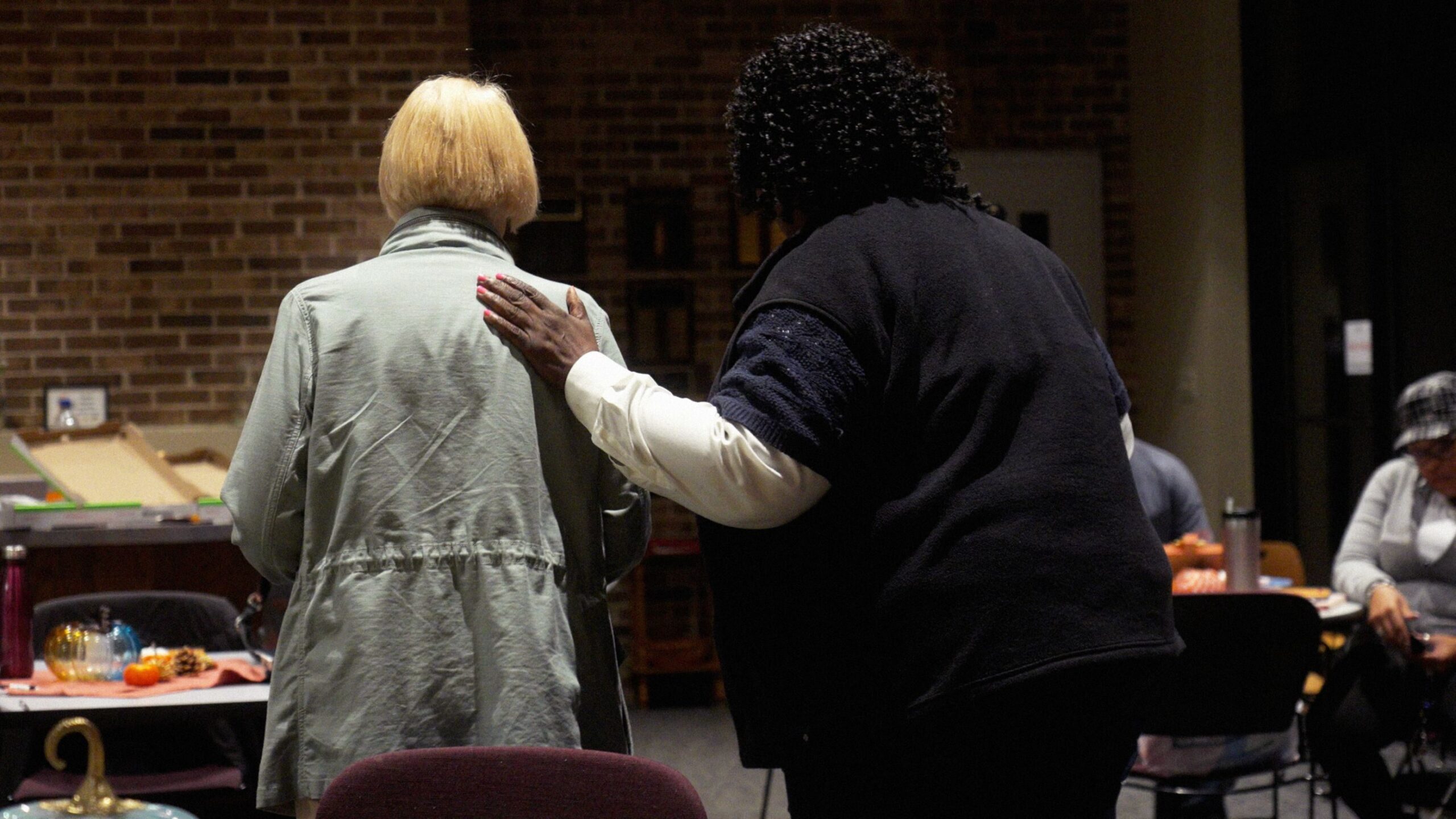 Congregation members share a moment during a bible study meeting for Hope Presbyterian and Bethel New Life churches, in Wheaton, Illinois.
