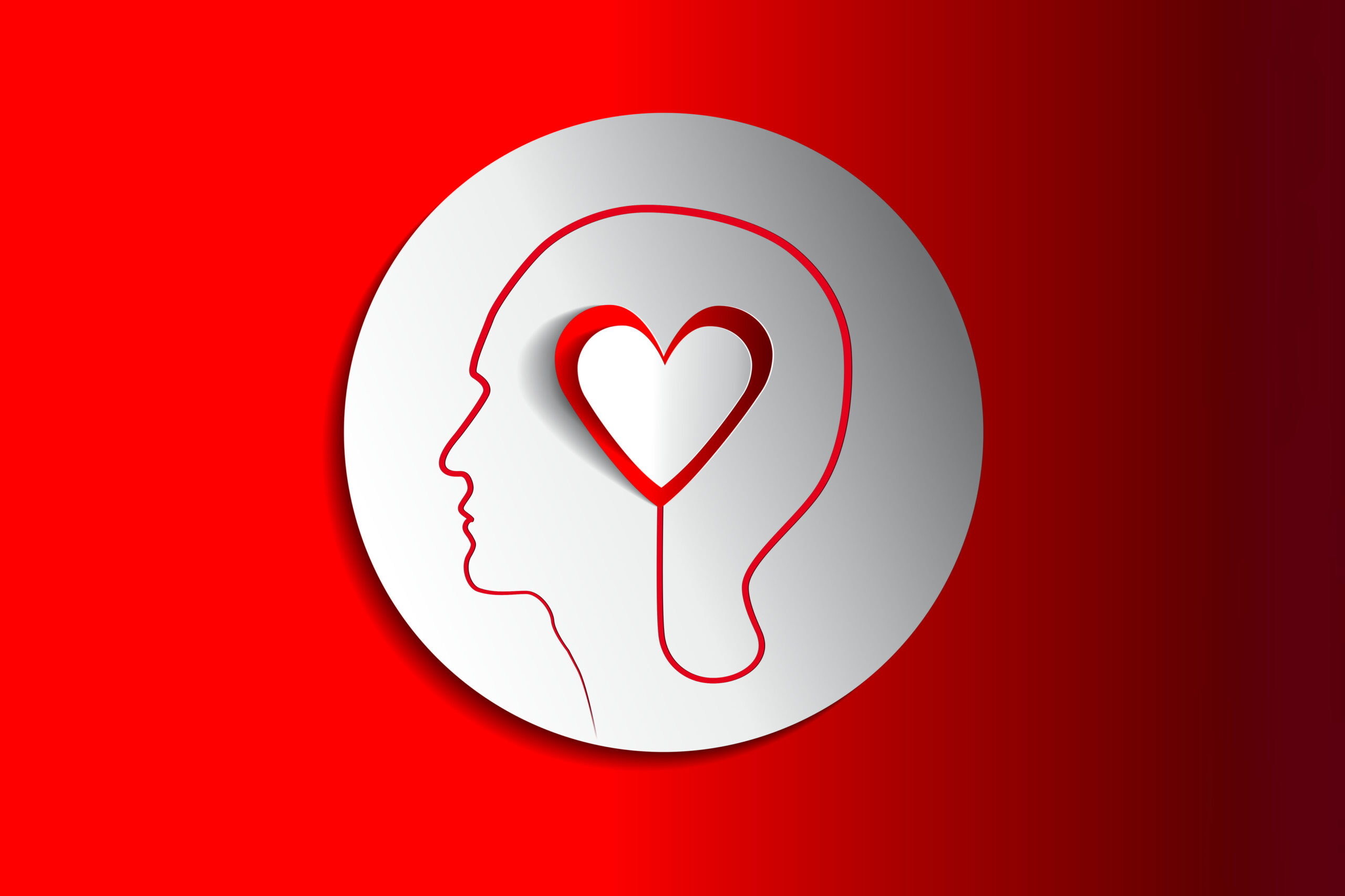 An illustration depicting a human head profile containing a red and white heart, set within a white circle on a red background.