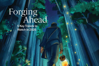 Illustrated January 2026 cover of The Chronicle of Philanthropy showing a person walking through a tall, glowing forest at night while holding a lantern. Firefly-like lights dot the trees, suggesting guidance and momentum. Cover text reads: “Forging Ahead: 5 Key Trends to Watch in 2026.”